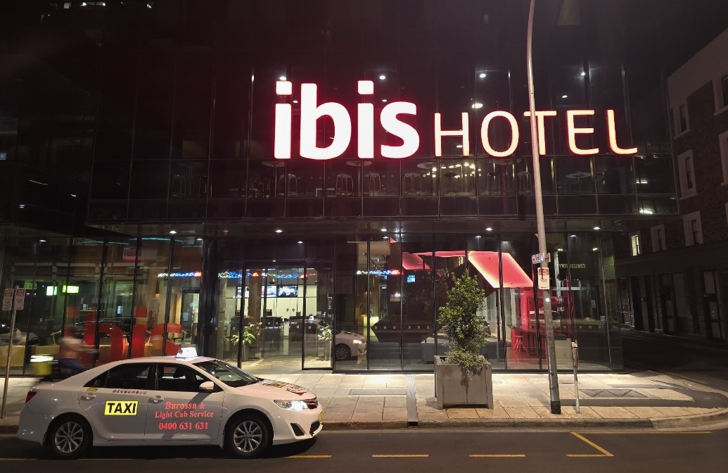Barossa & Light Cab Service taxi at Ibis Hotel Adelaide at night